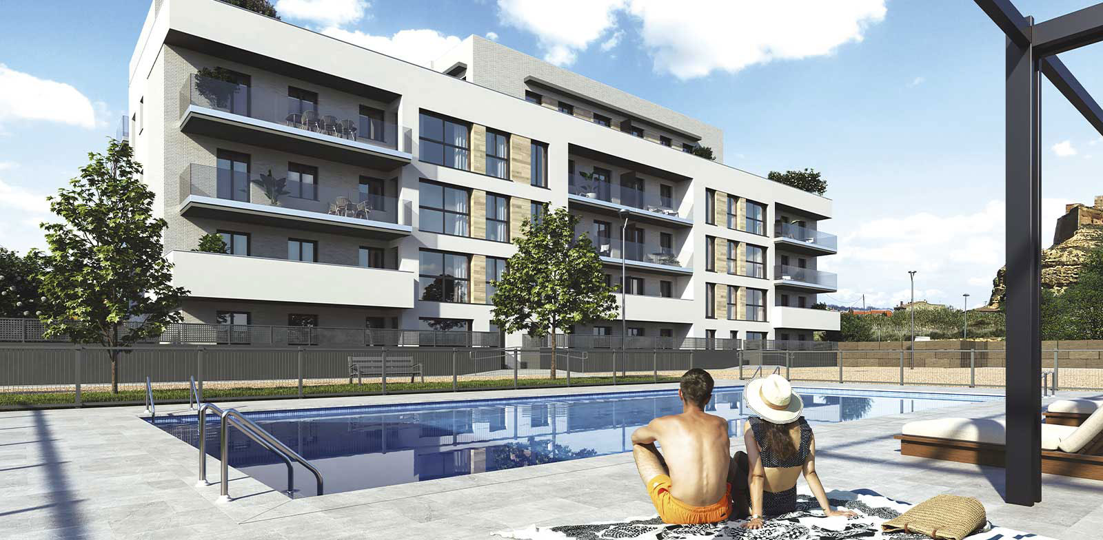 pareja tomando el sol en la piscina del edificio residencial la fuente de monzón